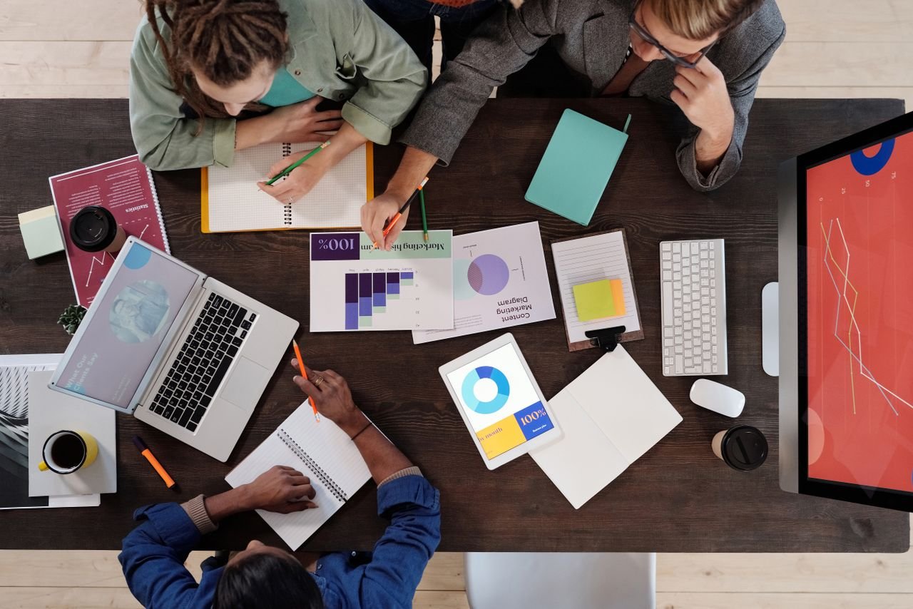 Crafting Captivating Headlines: Your awesome post title goes here Overhead view of a diverse team collaborating on a project in a modern office setting.